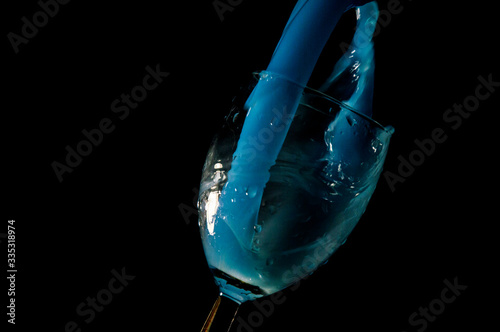 glass of liqueur on a black background