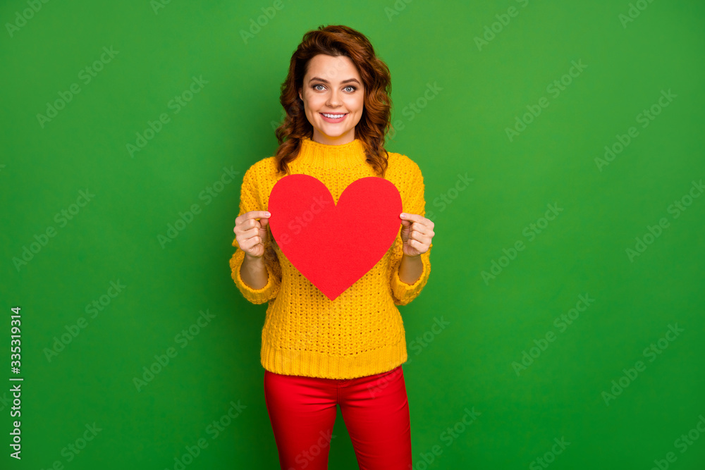 Photo of pretty charming wavy lady hold paper heart shape postcard invite boyfriend lover romance date wear yellow knitted sweater red pants isolated bright green color background Photo of pretty charming wavy lady hold paper heart shape postcard invite boyfriend lover romance date wear yellow knitted sweater red pants isolated bright green color background