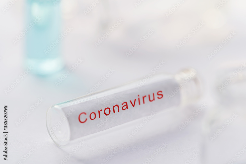 Obraz premium Corona virus Vaccine development Background. Coronavirus testing kit, Blank test tube or glass vile over white laboratory desk for collecting blood sample of chinese virus covid-19 with copyspace. 
