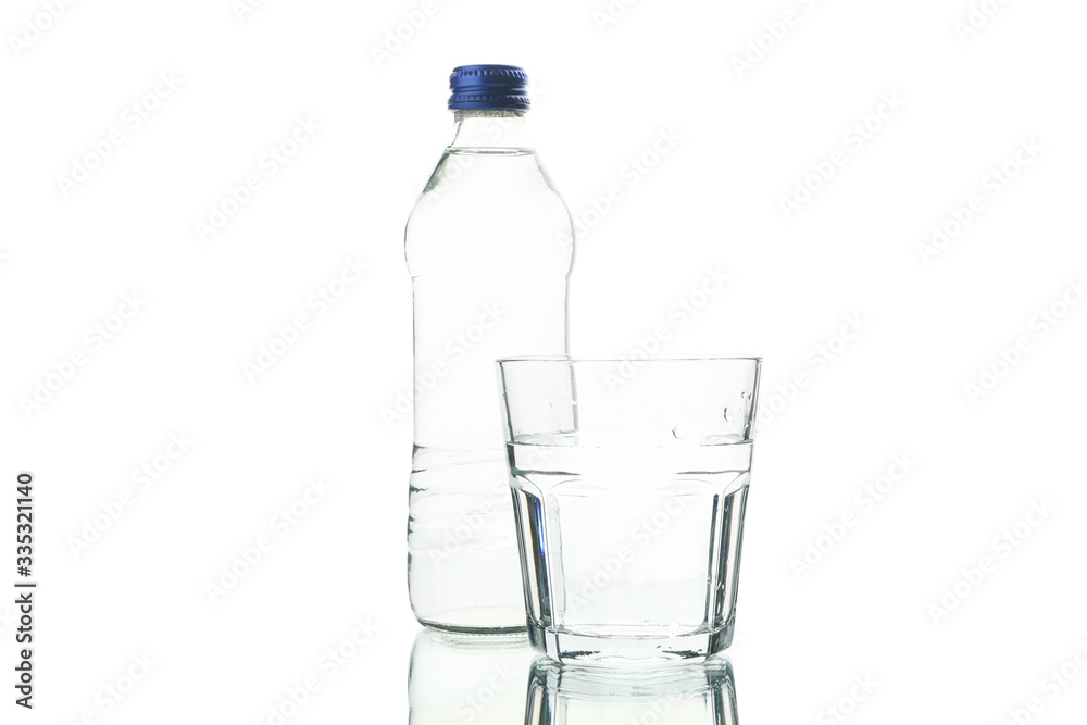 Bottle and glass with water isolated on white background Bottle and glass with water isolated on white background