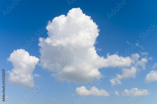 Blue background and huge clouds fluttering in the sky