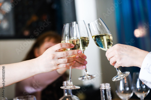 waiter pouring champagne into a glass