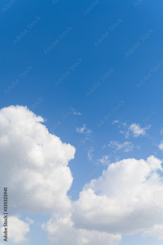 Blue background and huge clouds fluttering in the sky Blue background and huge clouds fluttering in the sky