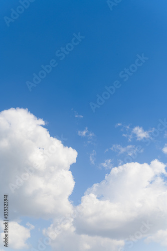 Blue background and huge clouds fluttering in the sky © Jarek Pawlak
