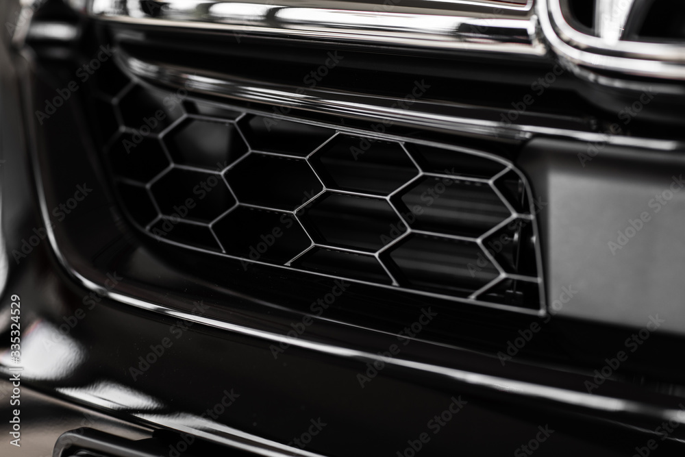 Grid of white sports car. The radiator grille. Metal texture. chrome grille of a big powerful. Front of the car. Radiator grill of luxury sports car. Plastic or metal grill. radiator grill Grid of white sports car. The radiator grille. Metal texture. chrome grille of a big powerful. Front of the car. Radiator grill of luxury sports car. Plastic or metal grill. radiator grill