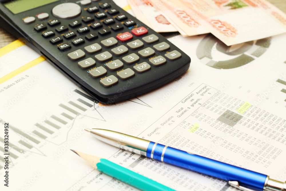 Business concept with a report and a calculator Business concept with a report and a calculator