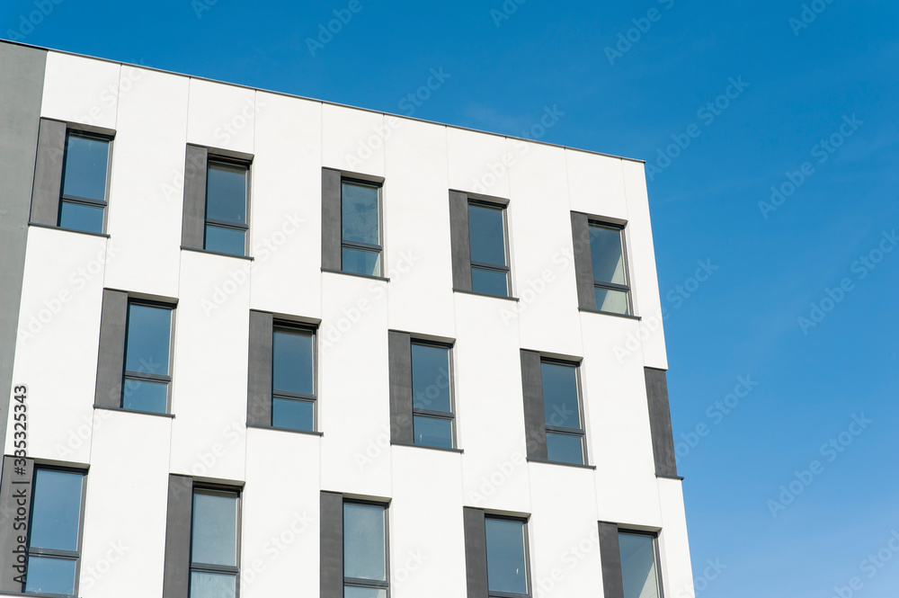 White and grey facade of modern office building