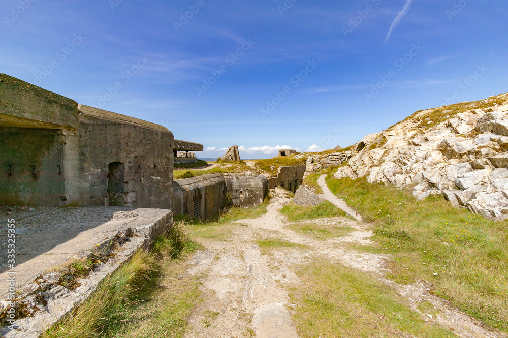 ruins of German WWii atlantic-wall bunkers at the rocky coastline of Brittany, France