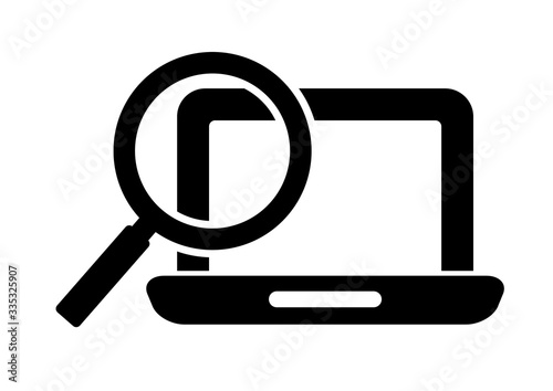 computer and magnifying glass icon