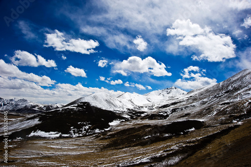 mountain landscape with clouds in Tibet China  © wenbilly