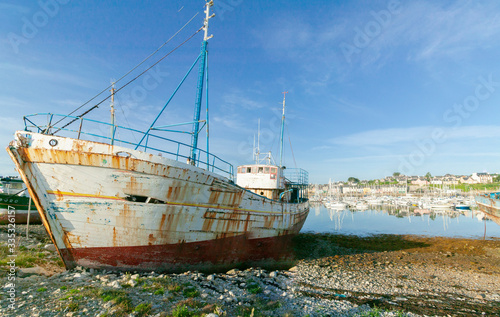 rotten fishing vessels on the beach of the pitouresk breton village of Camaret sur mer