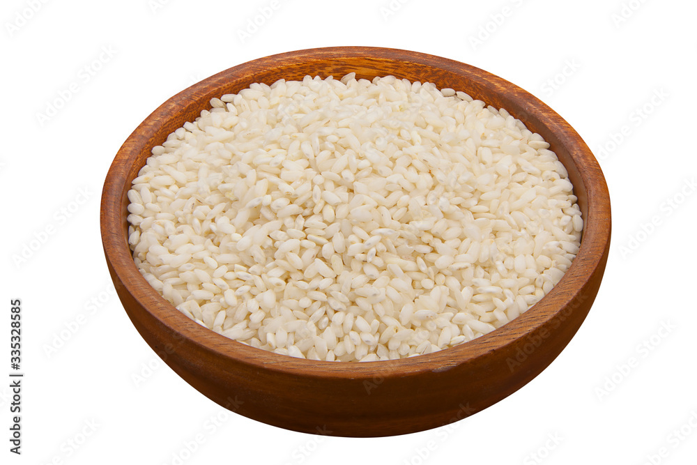 Raw rice groats for risotto on plate Raw rice groats for risotto on plate