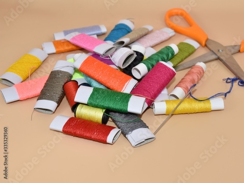 Colorful needles and threads for background