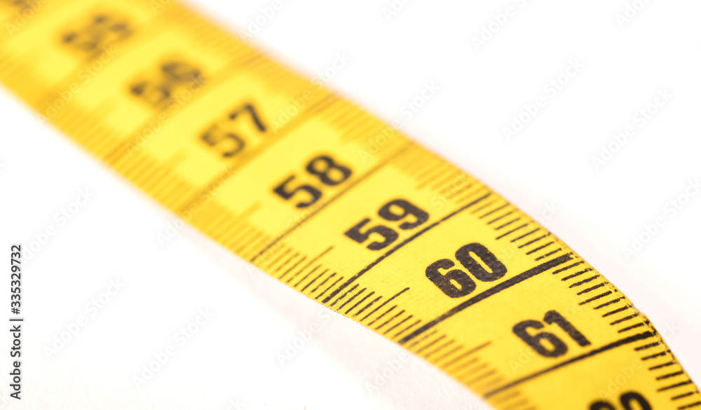 Close-up of a yellow measuring tape isolated on white - 60 Close-up of a yellow measuring tape isolated on white - 60