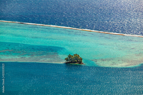 spectacular view over the barrier Reef between the Islands of Raiatea and Tahaa, Society Island, French Polynesia, South pacific Islands photo