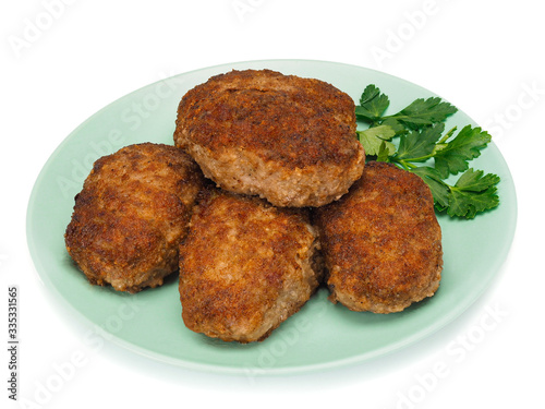 Homemade cutlets on a plate and on white background.