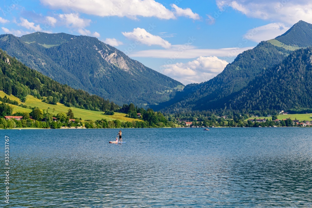 Schliersee, Bavaria, Bayern, Germany. Beautiful view on lake with alps mountains, blue sky with clouds. 
