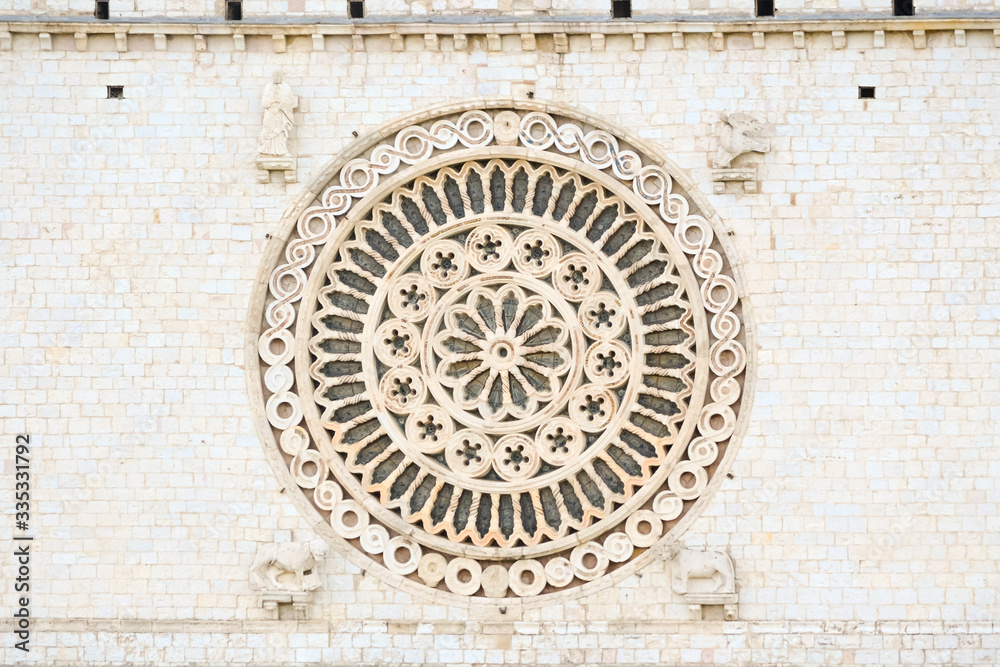 Assisi in Umbria, central part of Italy. The detail of the facade of the st. Francis church a Unesco monument full of art and the final stop of the pilgrimage of Saint Francis