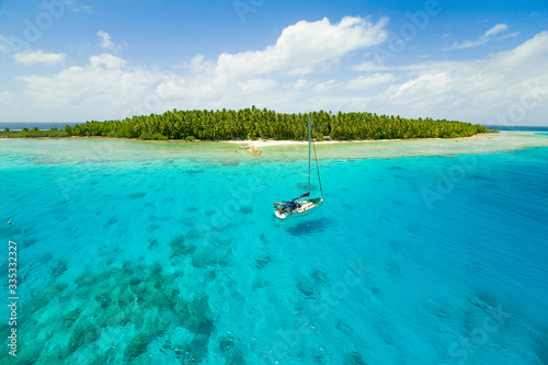 Sailing yachts anchoring in the shallow waters of suwarrow atoll  cook islands  polynesia  pacific ocean