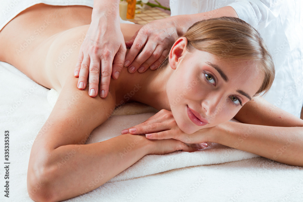 Massage and body care. Spa body massage women hands treatment. Woman having massage in the spa salon for beautiful girl Massage and body care. Spa body massage women hands treatment. Woman having massage in the spa salon for beautiful girl