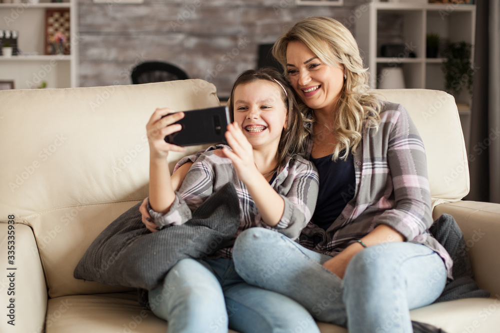 Little girl showing her braces while taking a selfie Little girl showing her braces while taking a selfie