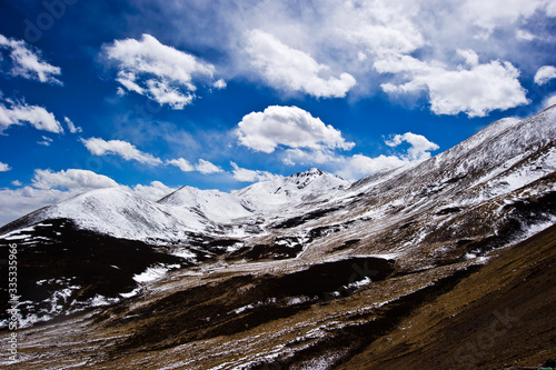 snow mountains and clouds in Tibet China  © wenbilly