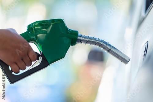 Картината върху платно Handle pumping gasoline fuel nozzle to refuel