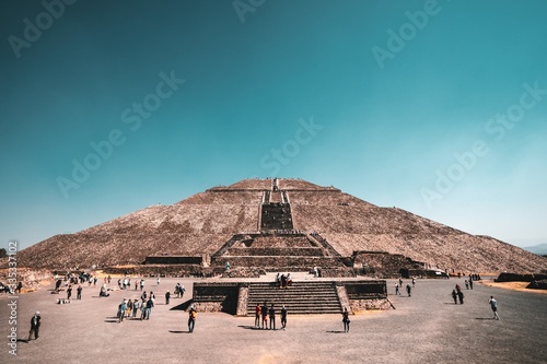 Low angle shot of The Pyramid of the Sun in Teotihuacan, Mexico with a clear sky in the background photo