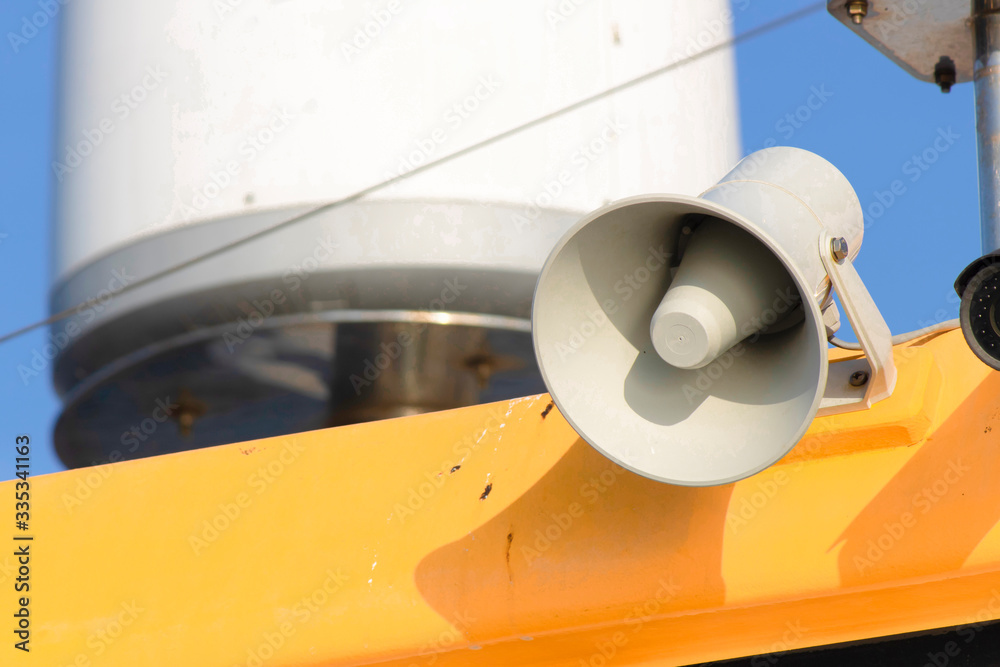 White megaphone on the ship. It is used for communication and warning.