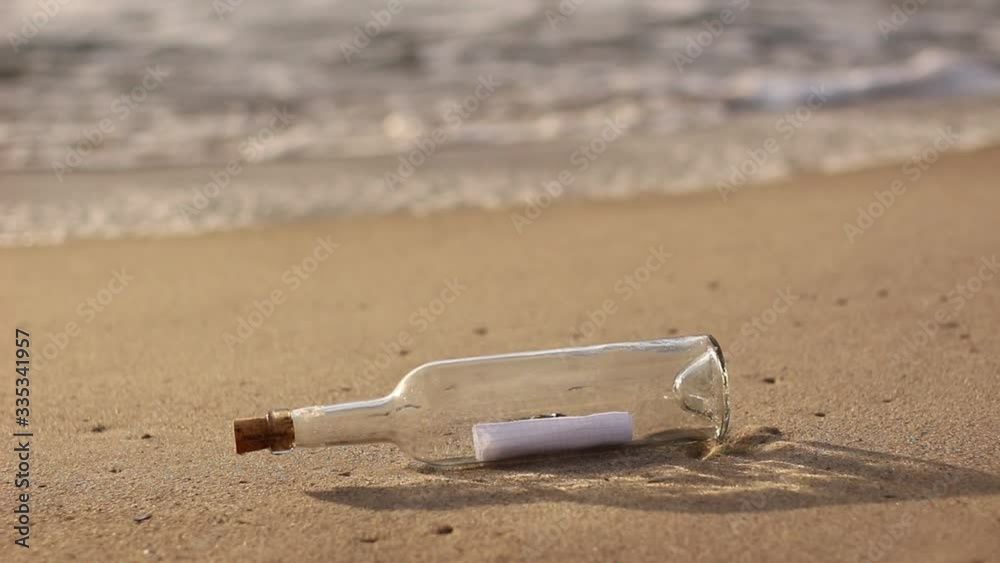 message in a bottle by the ocean, A Letter or message in a bottle on the shore,cast out by ocean or sea