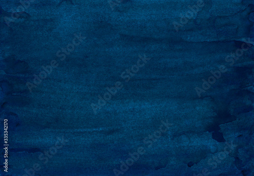 Watercolor dark indigo blue background painting. Vintage deep blue color hand painted watercolour backdrop. Stains on paper texture.
