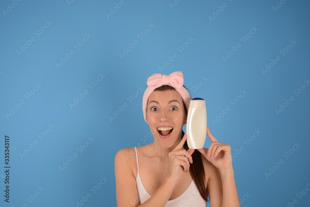 young woman holding a body cream beauty spa young woman holding a body cream beauty spa