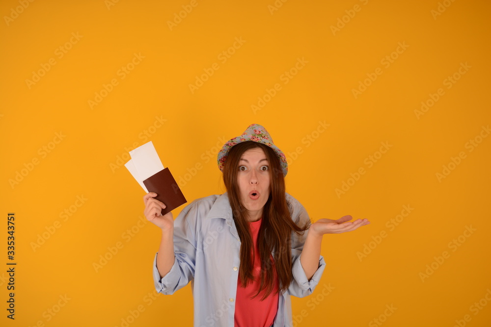 woman in a hat holding a passport and plane tickets holiday travel woman in a hat holding a passport and plane tickets holiday travel