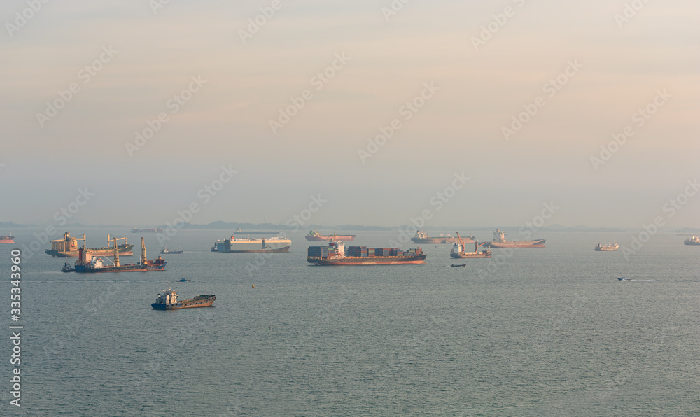Cargo ships and oil tankers anchored offshore along the Singapore Straight, in Singapore