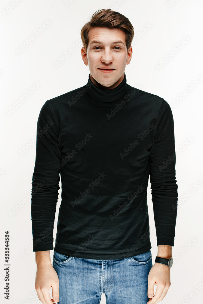 young man wearing turtleneck on white studio background young man wearing turtleneck on white studio background