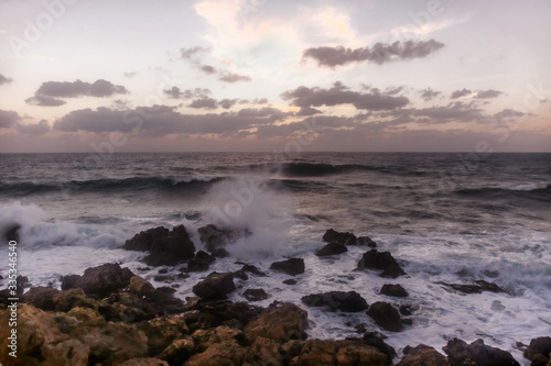 Stormy sunset on the Mediterranean Sea. Evening. Rocky coast. Sea Caves  Peyia  Cyprus