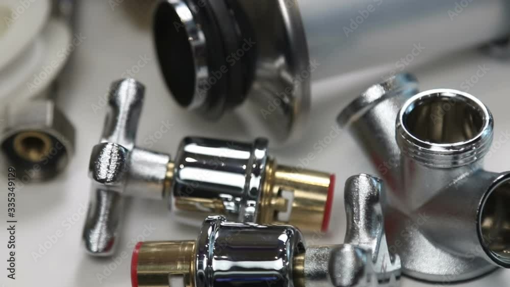 different plumbing fixtures for use in the bathroom and toilet room, in the kitchen on a white background. The video dolly different plumbing fixtures for use in the bathroom and toilet room, in the kitchen on a white background. The video dolly