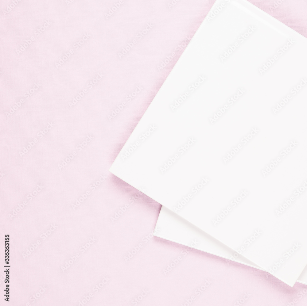 photo books, albums, books, a pack of photo books, on a pink peach background, a stack of books, book corners photo books, albums, books, a pack of photo books, on a pink peach background, a stack of books, book corners