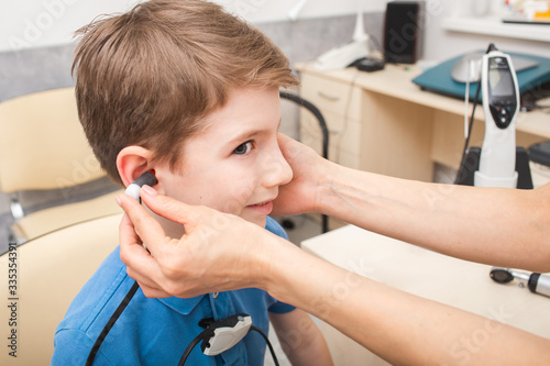 Boy in hearing clinic. Impedance audiometry. Methods for testing the middle ear in a child