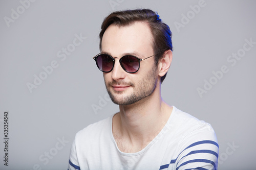 Studio shot of handsome man wearing sunglasses © sarymsakov.com