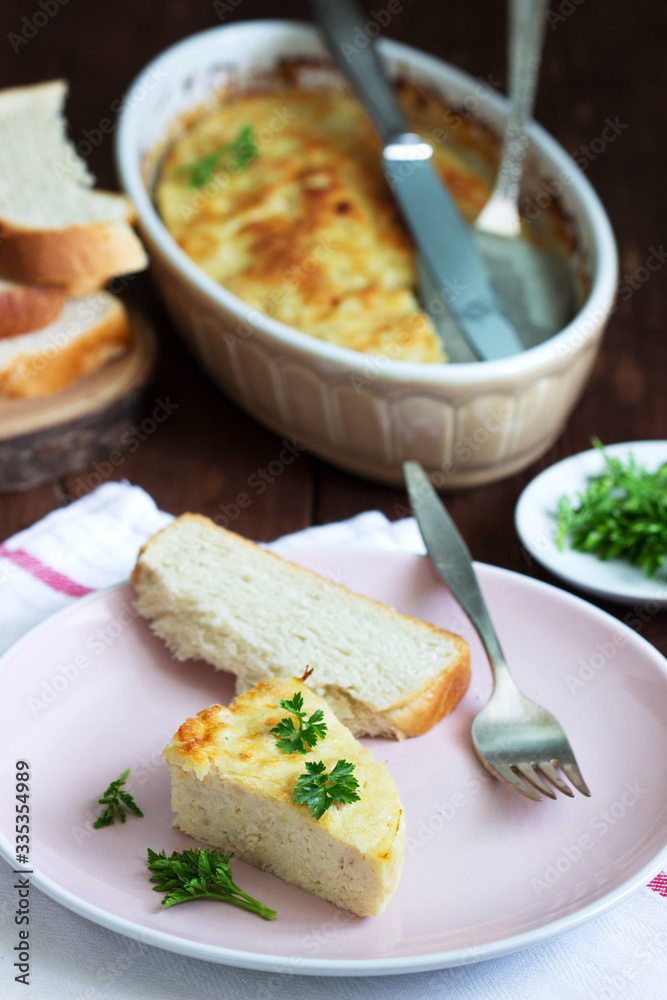 Dietary souffle of minced meat with parsley on a dark background. Dietary souffle of minced meat with parsley on a dark background.