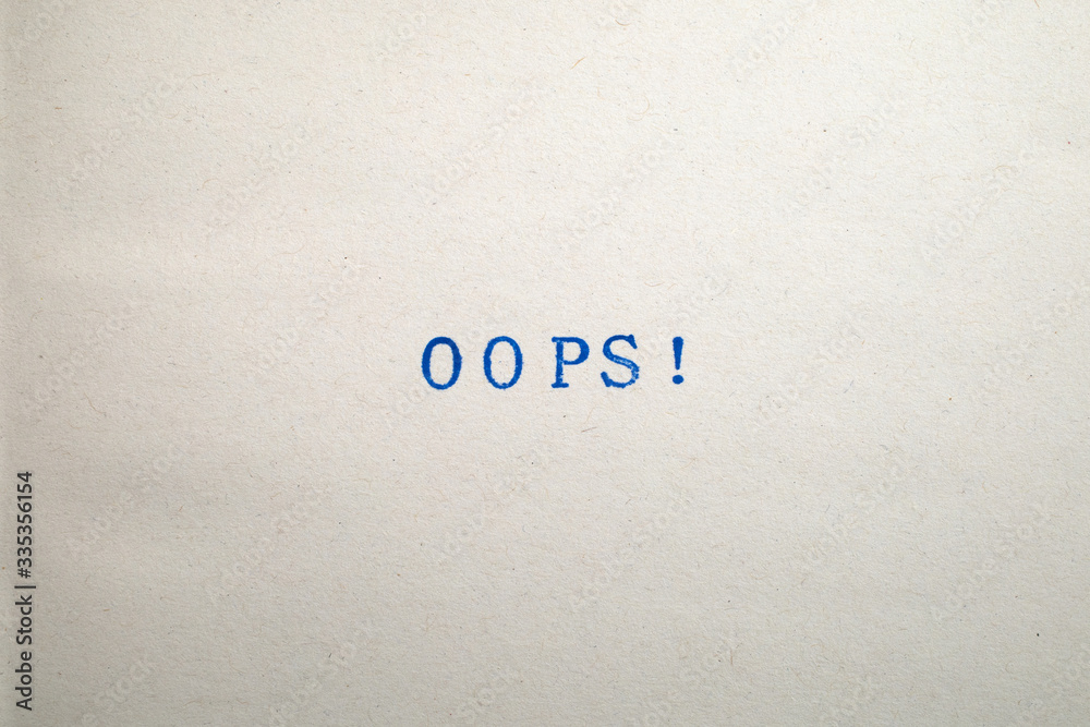 a OOPS! word stamped on a piece of paper. a OOPS! word stamped on a piece of paper.