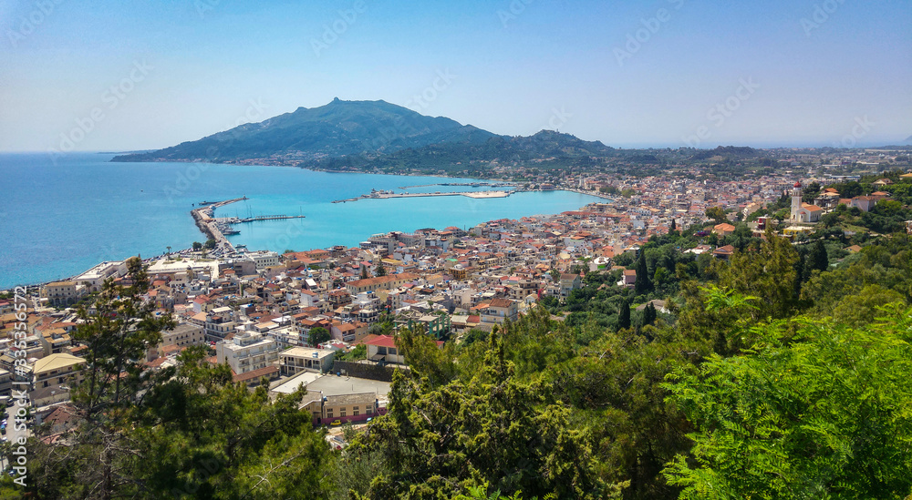 Zakyntos city and port from top panorama view, with the blue sky, sea, and mountain in background