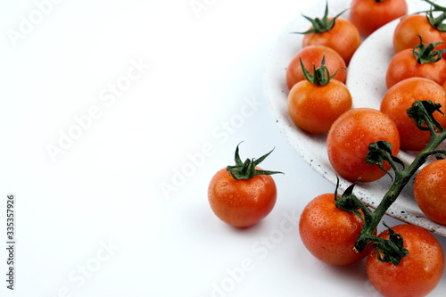 small cherry tomatoes on a white background