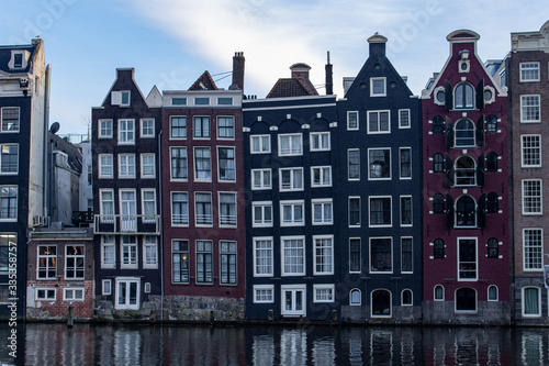 Colourful architecture in the centre of Amsterdam by the canal 