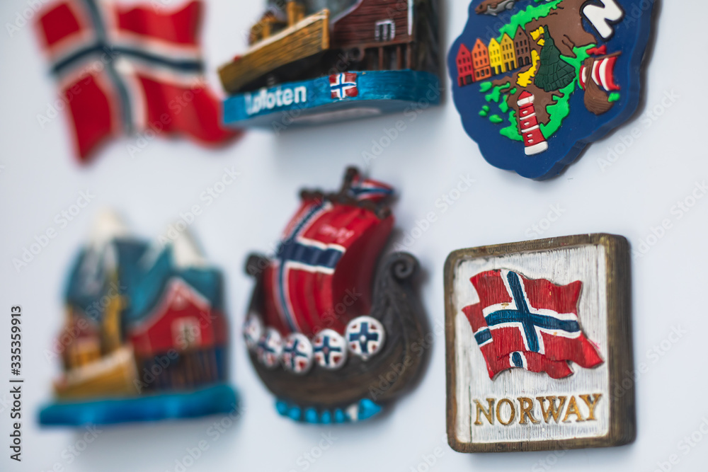 View of traditional tourist souvenirs and gifts from Lofoten Islands, Nordland, Norway, fridge magnets with text 