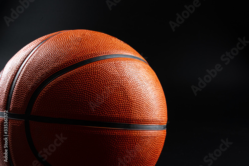 Basketball ball close up on dark black background. Basketball concept © fotofabrika