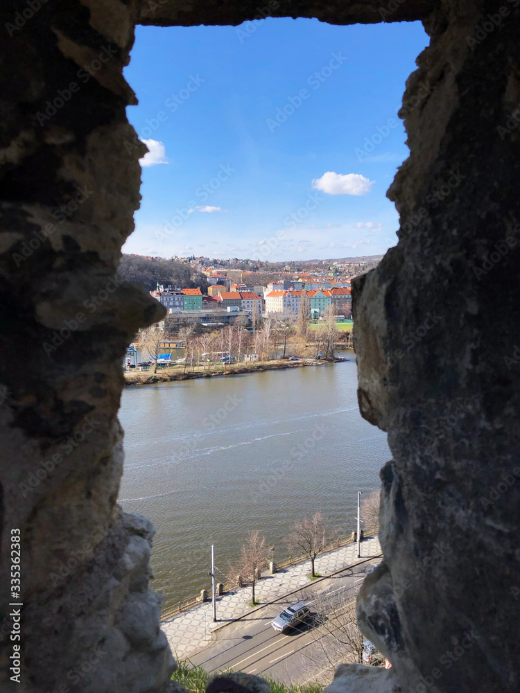 View of the river through the slim windows of the defensive  walls of the Vysehrad Fortress