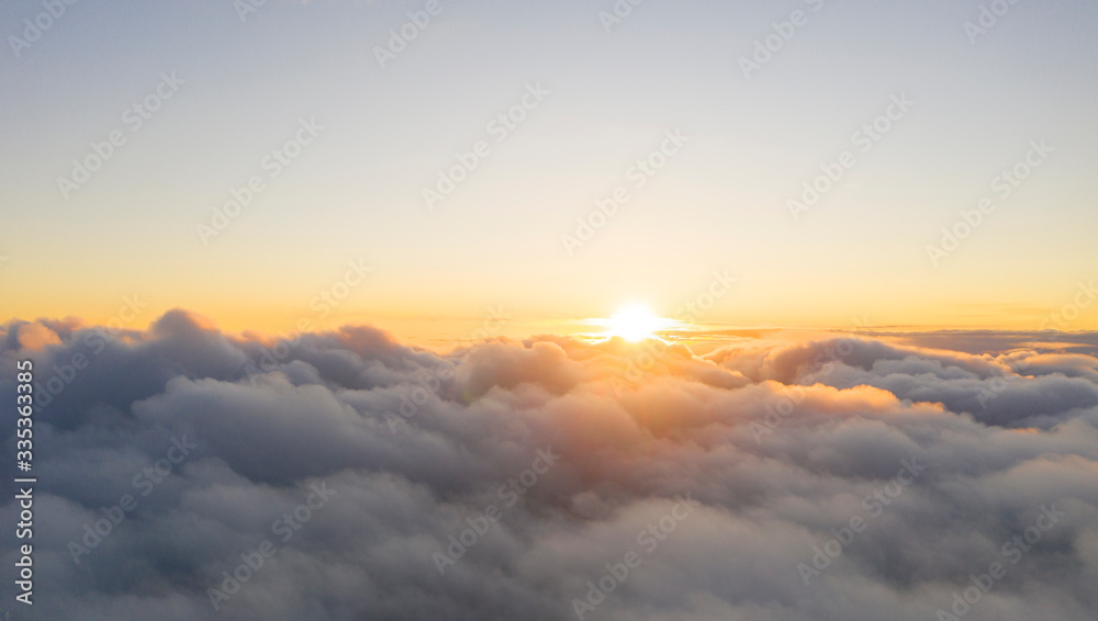 Aerial view White clouds in blue sky. View from drone. Aerial top view cloudscape. Texture of clouds. View from above. Sunrise or sunset over clouds. Panorama clouds - obrazy, fototapety, plakaty 