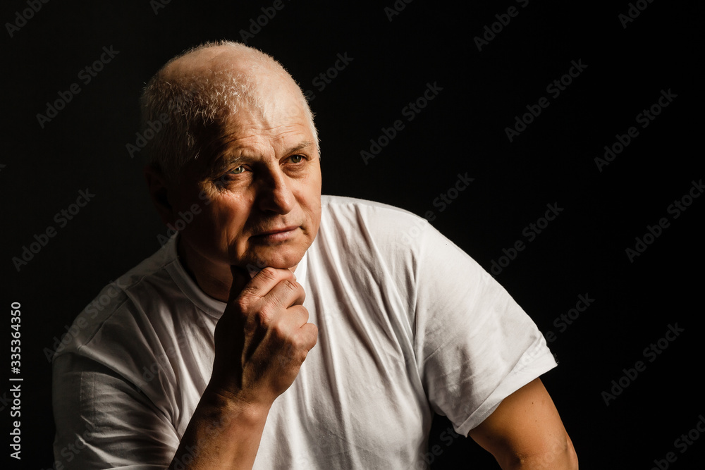 Old senior man closeup serious expression portrait